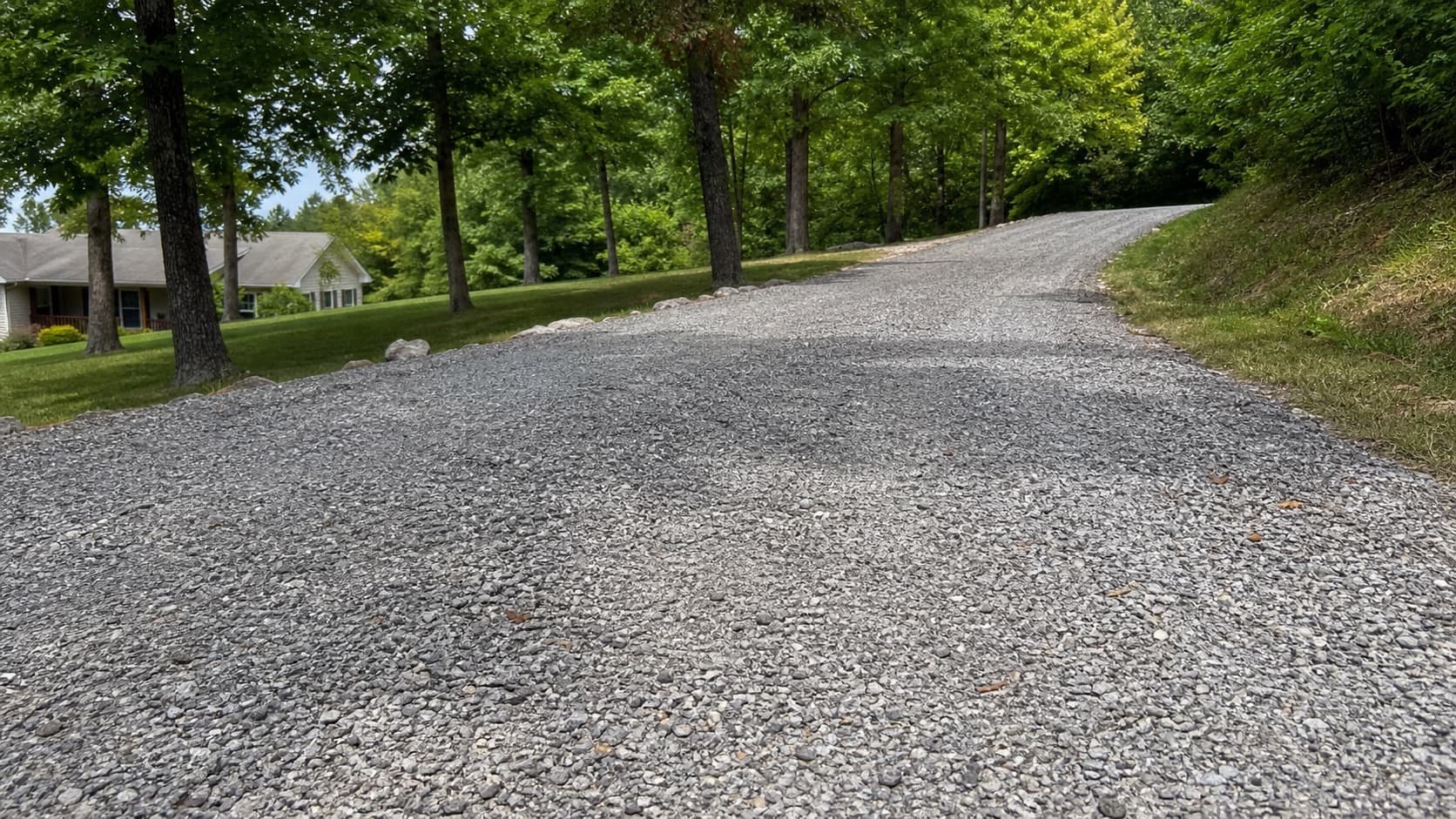 Freshly graded gravel driveway in a rural Jefferson County setting