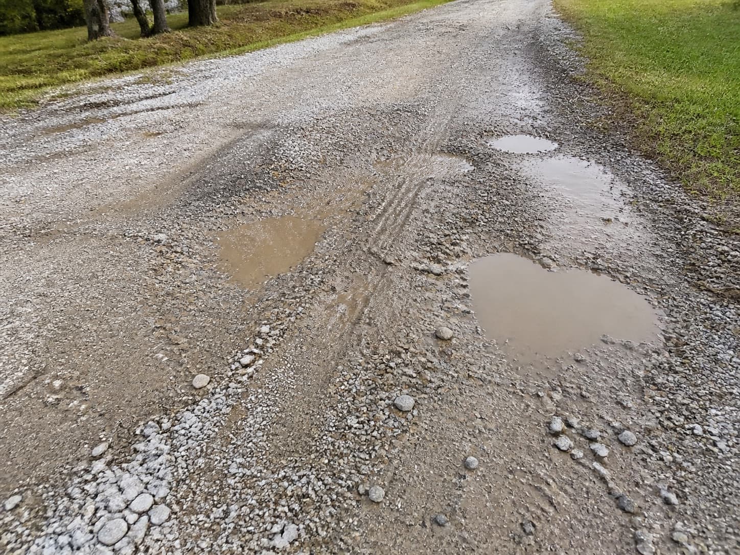 Potholes and low spots on a gravel driveway