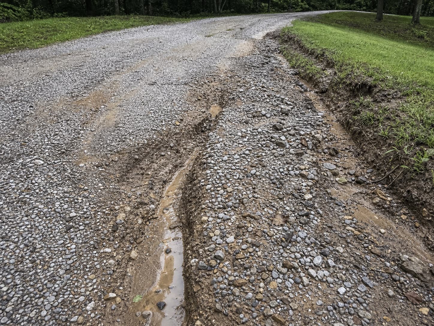 Washed-out gravel after rain on a gravel driveway